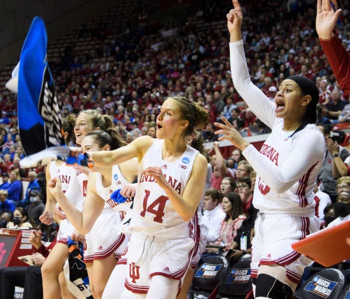Ali Patberg cheers on the bench.